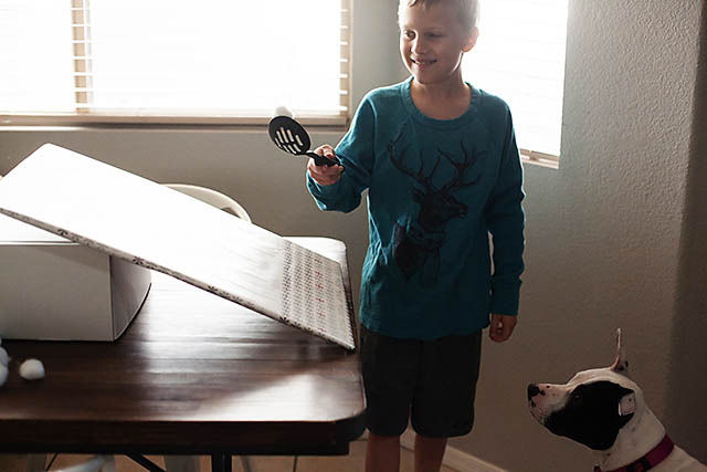 Snowball roll game using cotton balls from All for the Boys blog